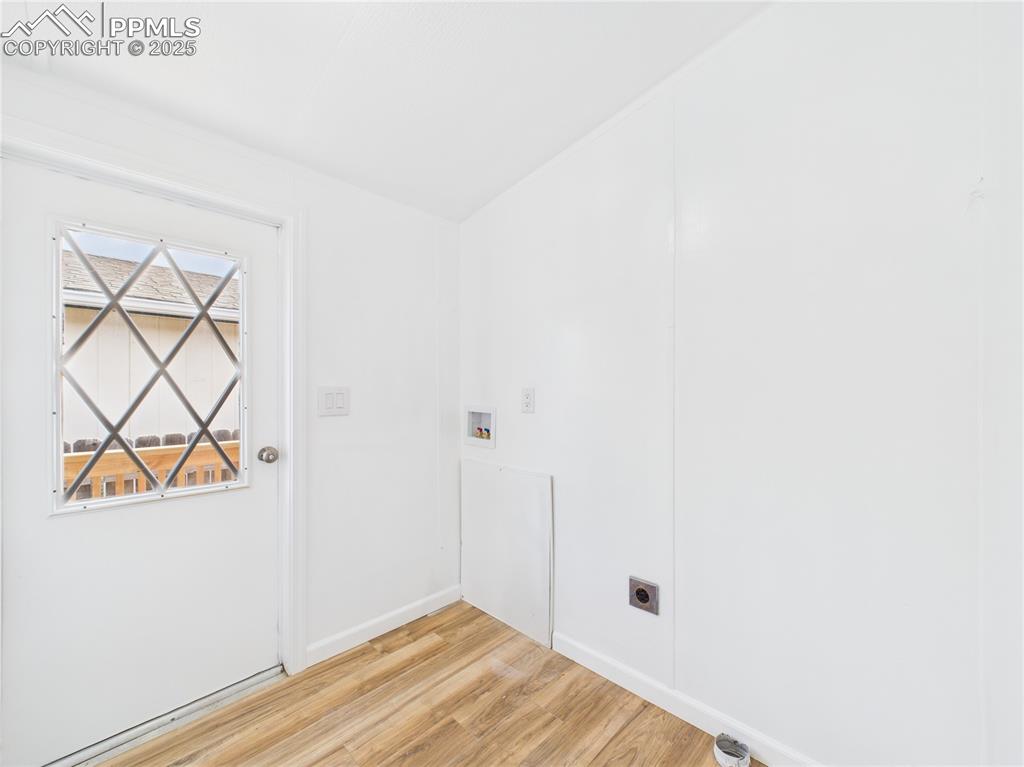 Image 13 of 34: Laundry area with electric dryer hookup, baseboards, laundry area, hookup f