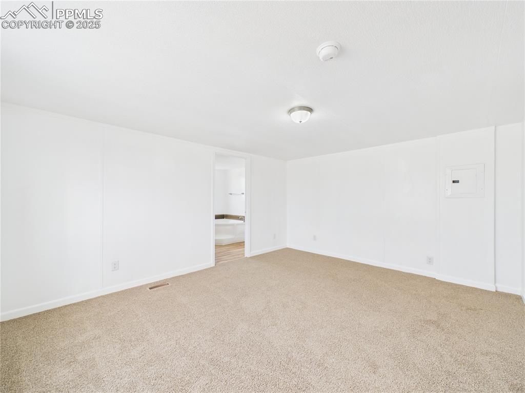 Image 14 of 34: Carpeted Primary Bedroom