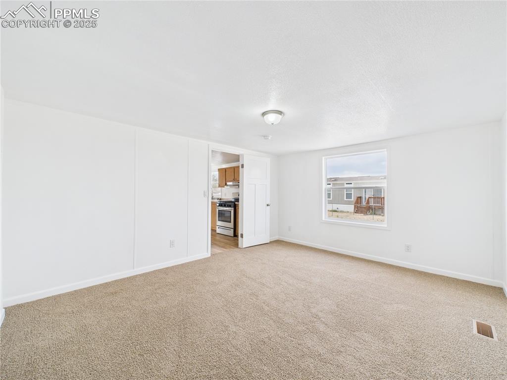 Image 15 of 34: Carpeted Primary Bedroom