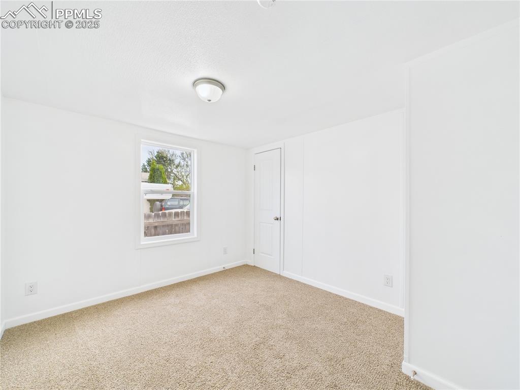 Image 20 of 34: Carpeted Bedroom