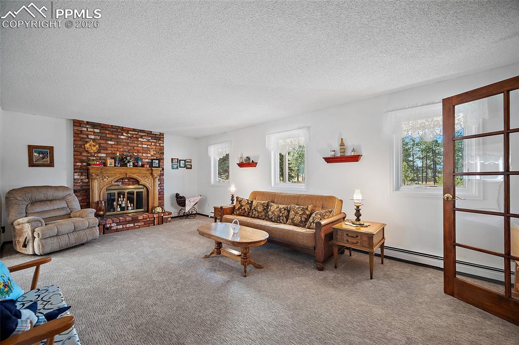 Image 10 of 49: Large and spacious Formal living room that connects with the formal dining