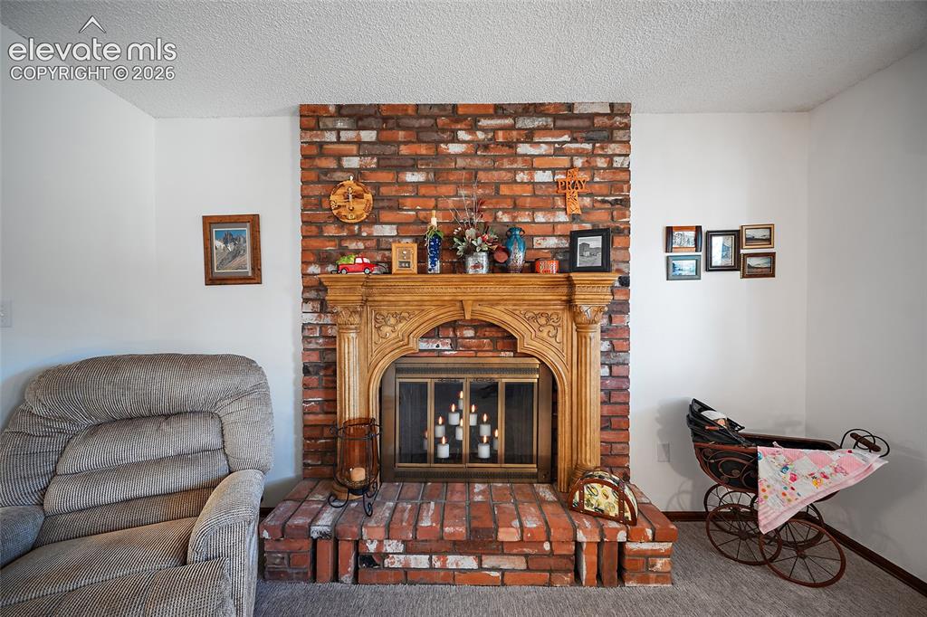 Image 10 of 50: Gas fireplace and French doors are just wonderful extra touches to this hom