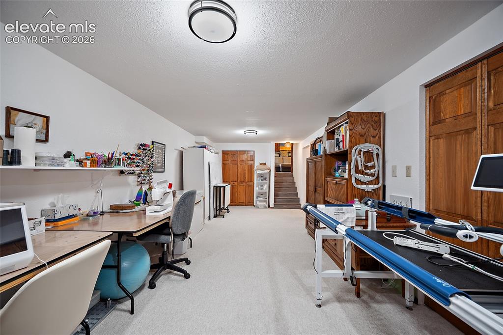 Image 20 of 50: This room is the 3rd common living space and currently being used as a quil