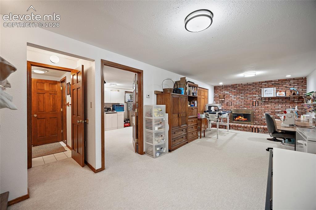 Image 21 of 50: This room is now being used as a quilting room but the possibilities are en
