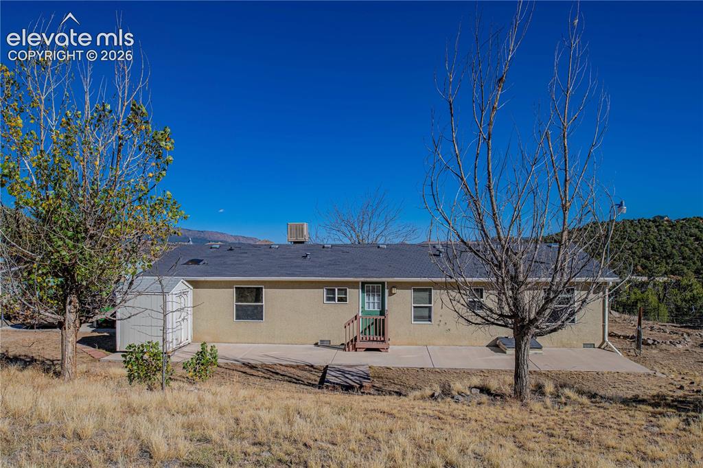 Image 29 of 48: Rear view of property with a patio area