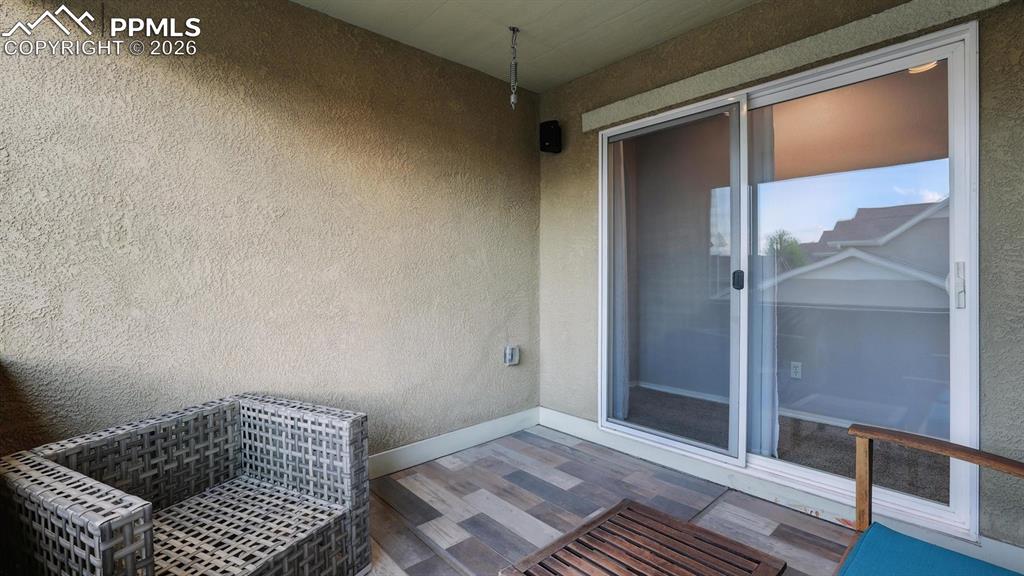 Image 13 of 50: Walk Out from the Kitchen to a covered patio for outdoor dining and relaxat