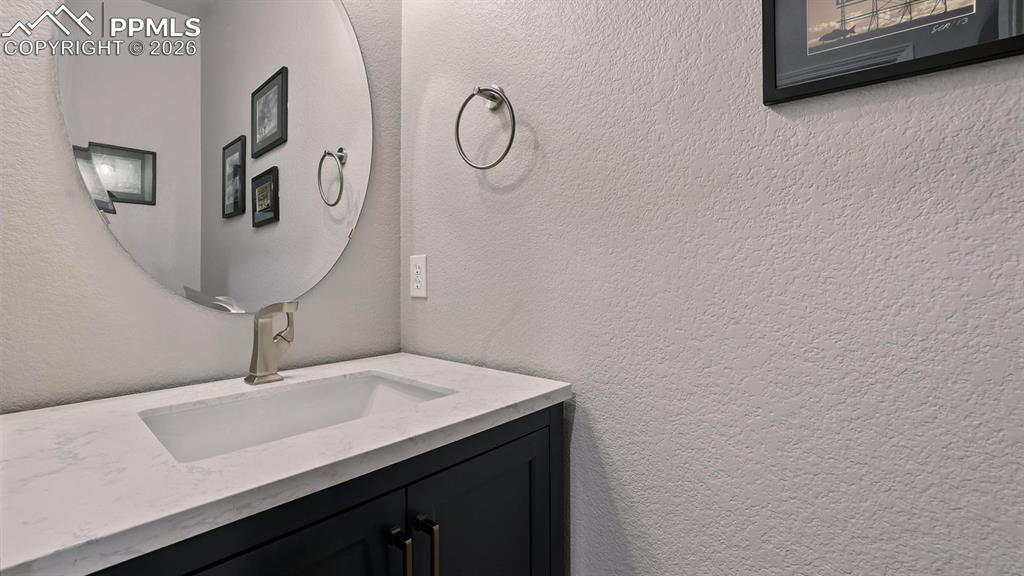 Image 18 of 50: Convenient Powder Bathroom for guests.