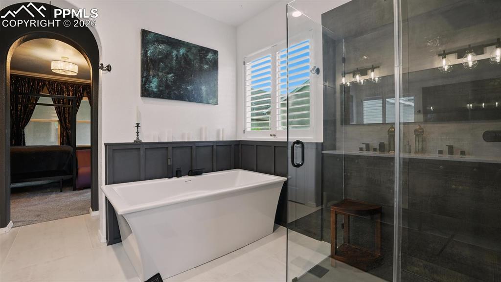 Image 24 of 50: Luxurious soaking tub in the Primary Bathroom.