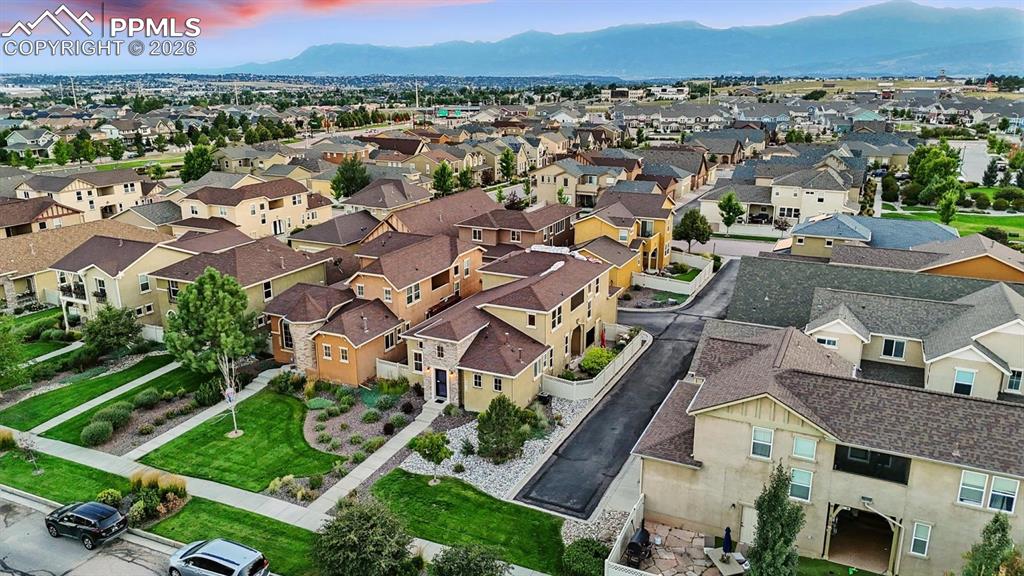 Image 4 of 50: Aerial view of home and corner lot.
