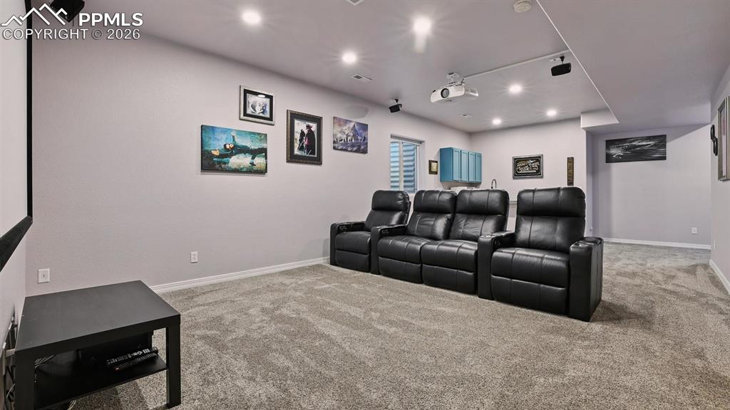 Image 42 of 50: View of Theatre Rom and wet bar.