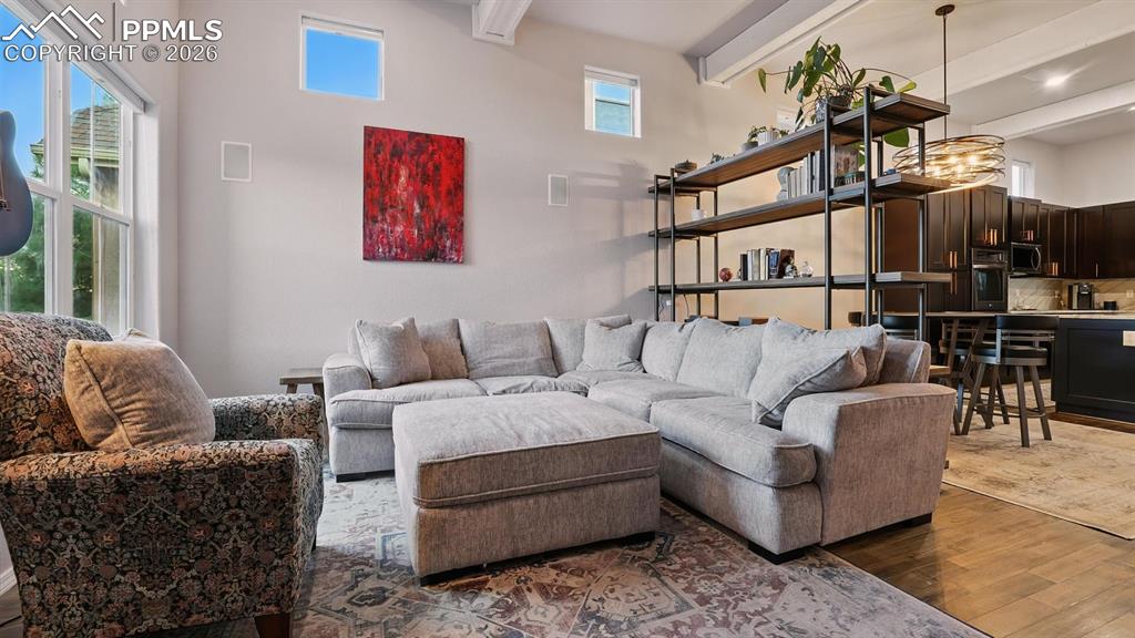 Image 8 of 50: The Living Room flows effortlessly into the Dining Room and Kitchen.