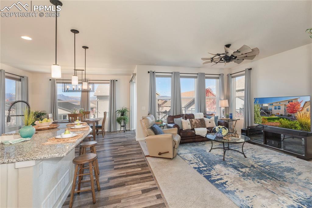 Image 12 of 50: Bright, open concept living, dining and kitchen area featuring panoramic mo