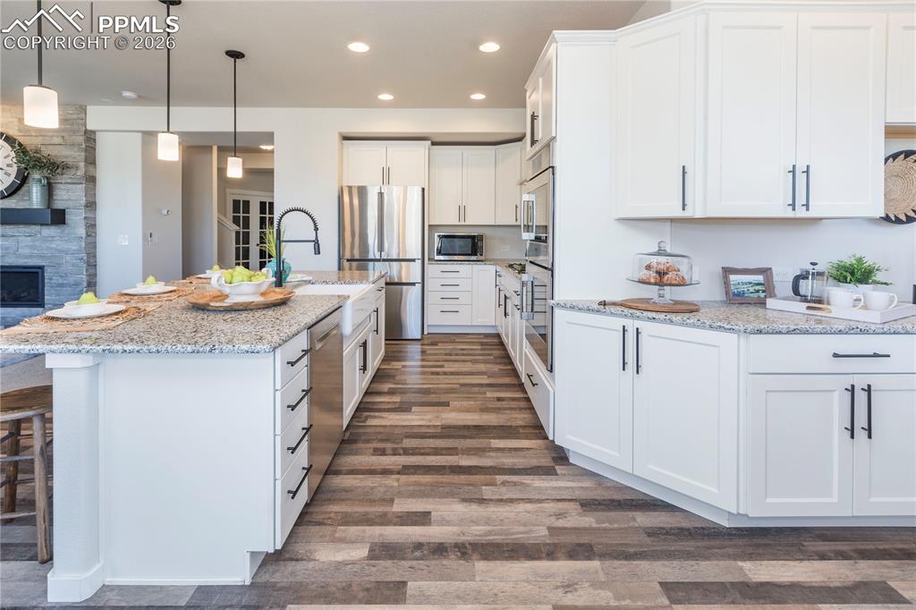 Image 17 of 50: Bosch stainless dishwasher, refrigerator and double ovens.