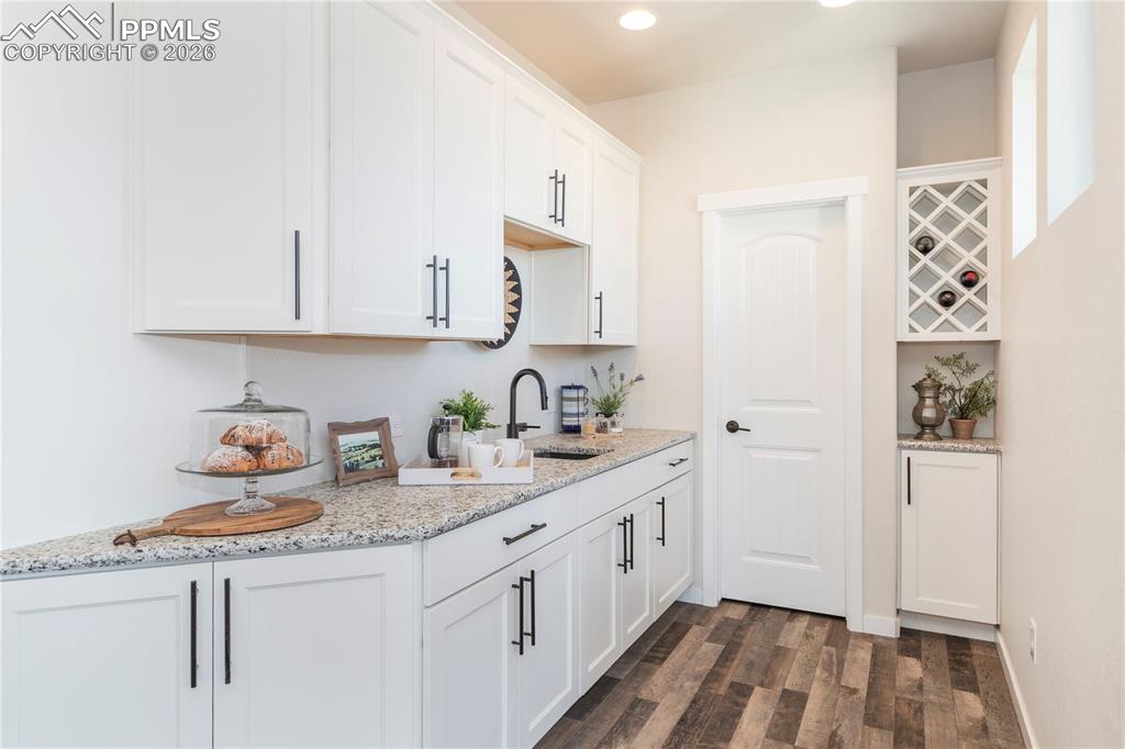 Image 19 of 50: The "scullery" - a secondary kitchen or prep area adjacent to the main kitc