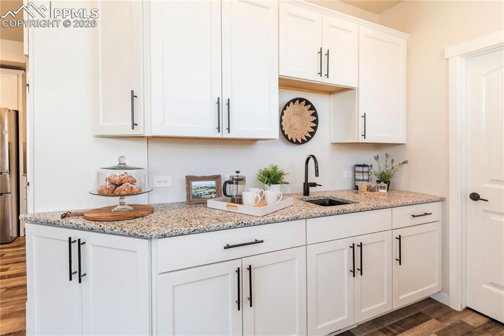 Image 21 of 50: Second sink, tons of cabinetry and a walk-in pantry.
