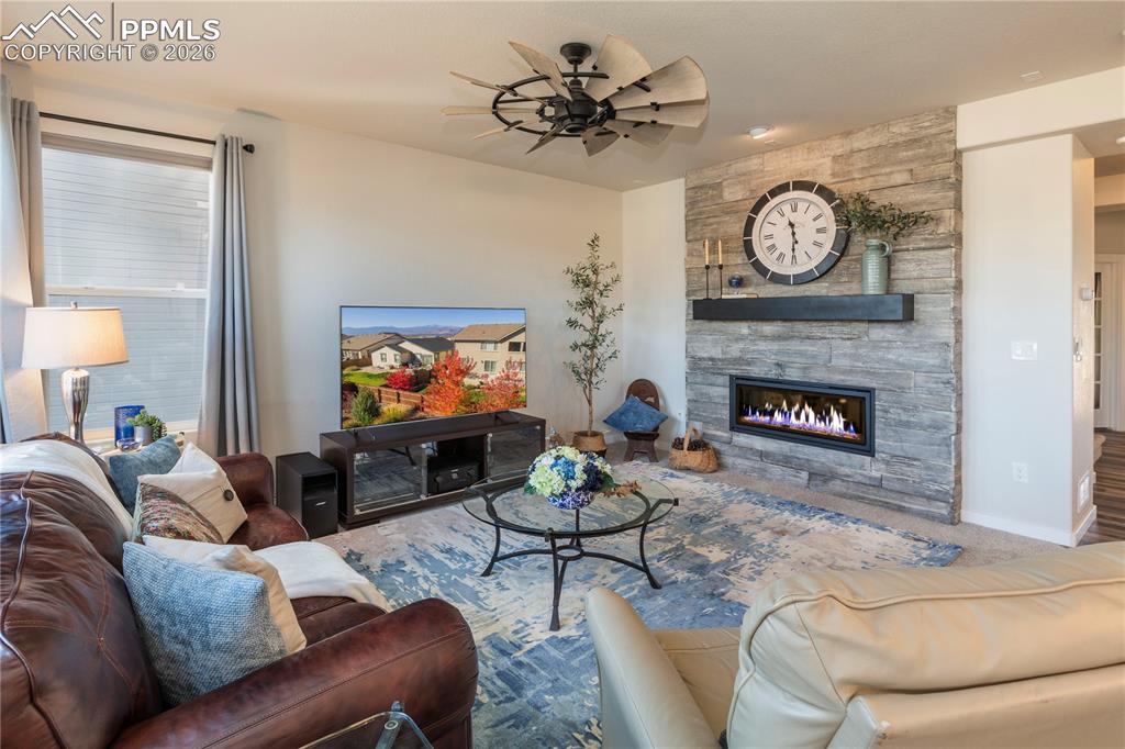 Image 25 of 50: Cozy gas fireplace creates a dramatic focal point.