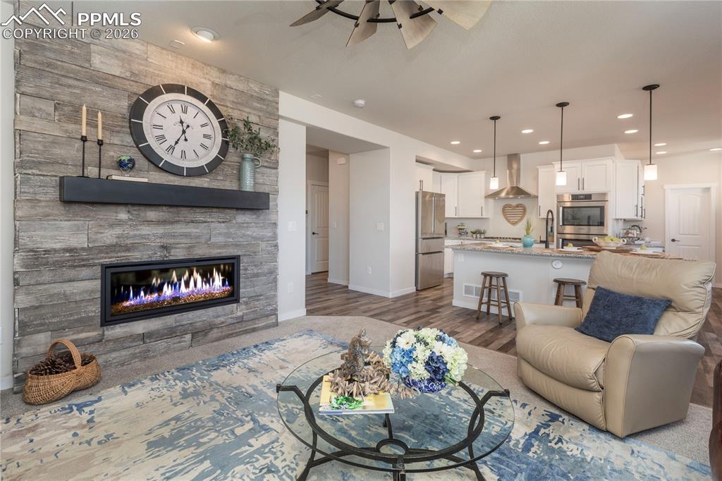 Image 26 of 50: Open concept living, kitchen and dining rooms.