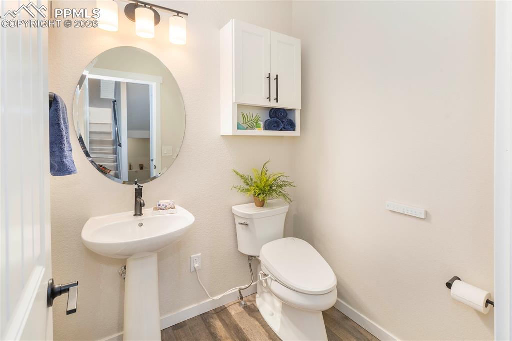 Image 28 of 50: Powder room off the front entrance.