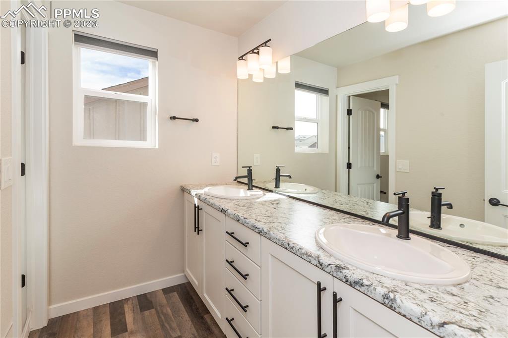 Image 39 of 50: Bathroom #4 is a full-size bath with a double vanity...