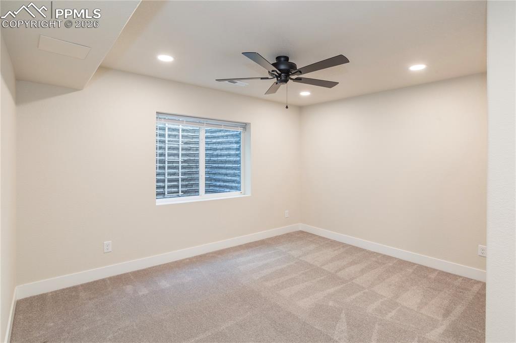 Image 43 of 50: Bedroom #5 in basement is quite spacious as well.