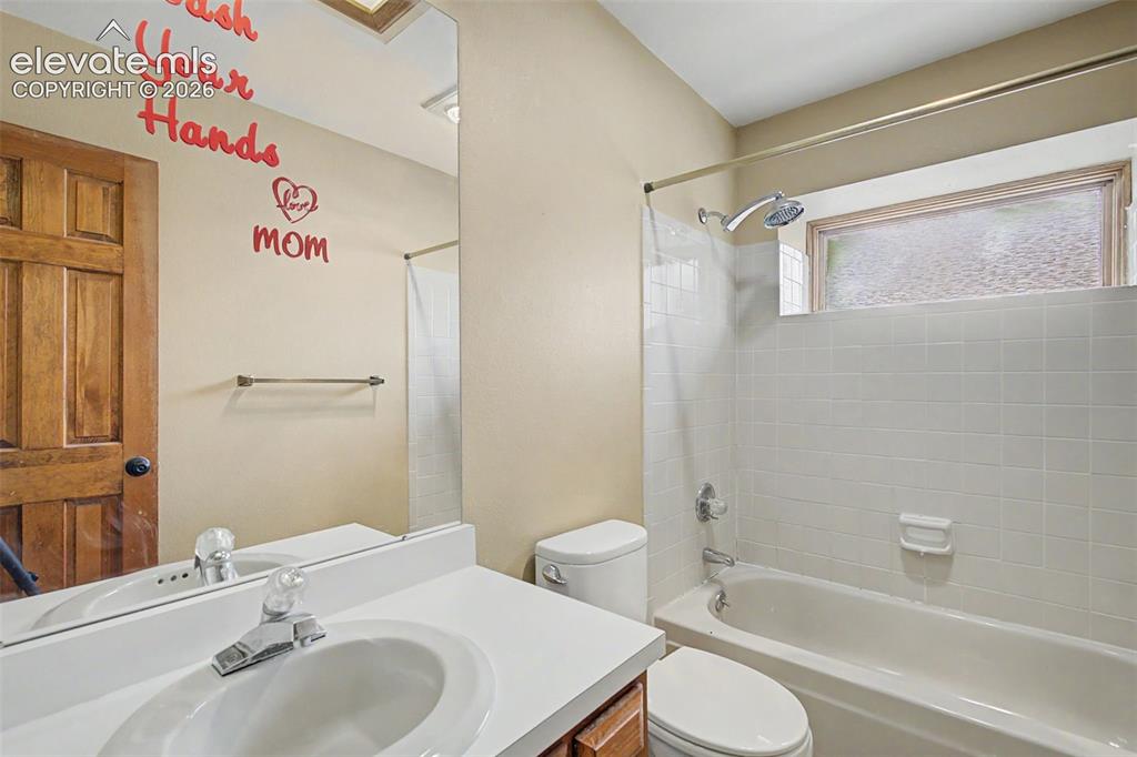Image 34 of 44: Bathroom with a single vanity, integrated sink, and white countertop