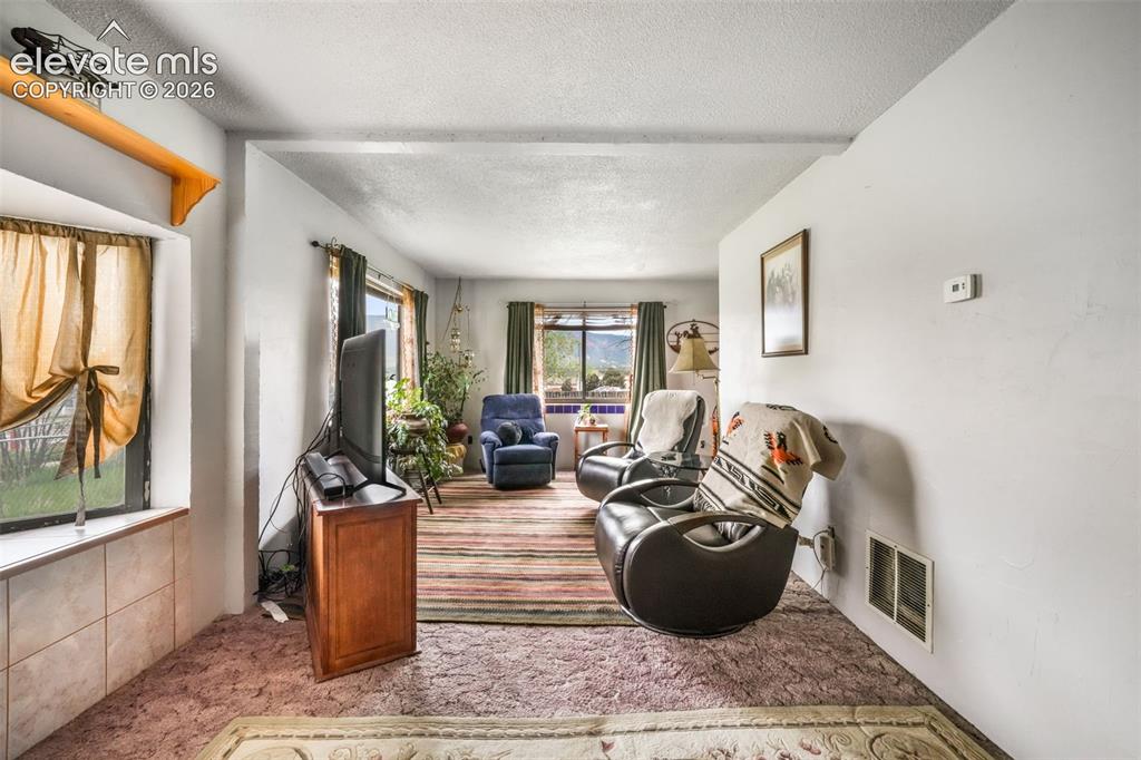 Image 11 of 50: Sitting Room