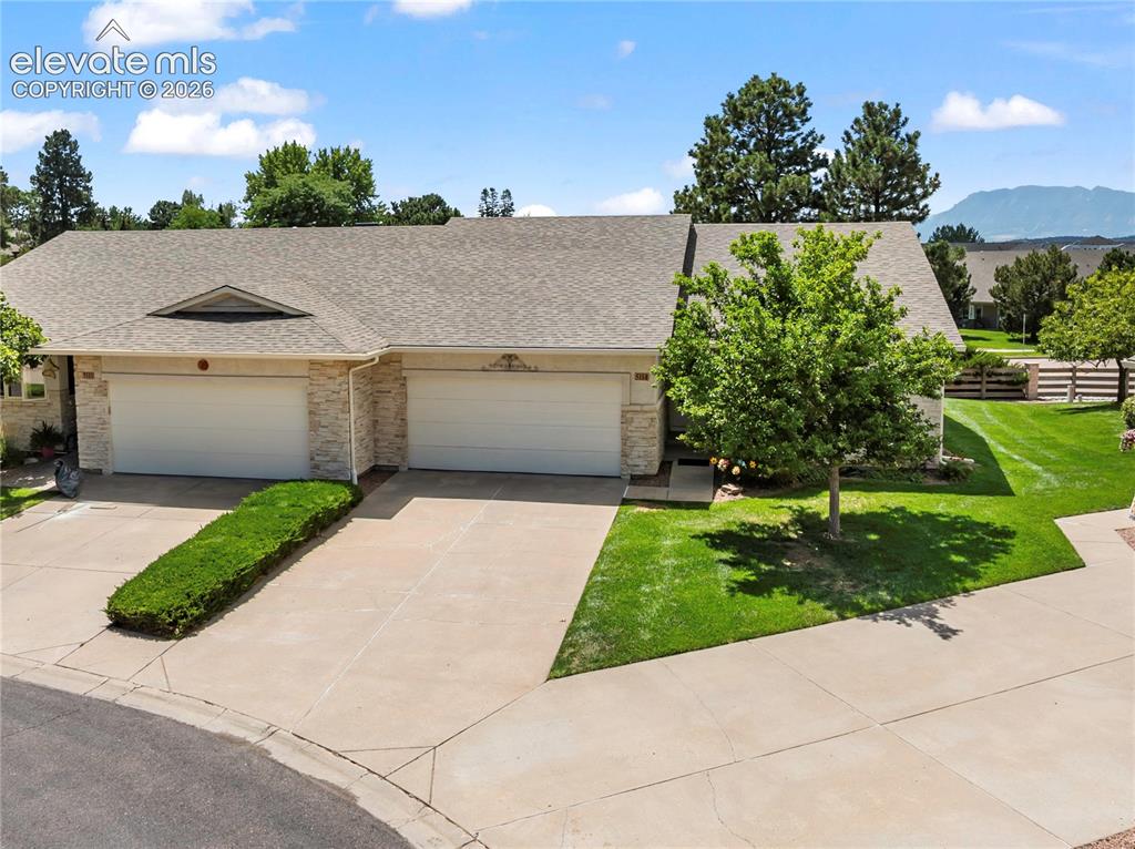 Image 1 of 43: This lovely townhome is an end unit featuring a greenbelt area and mountain