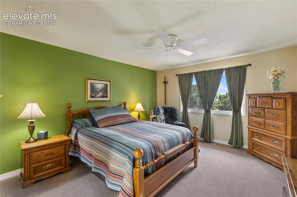 Image 31 of 43: Primary bedroom is spacious.