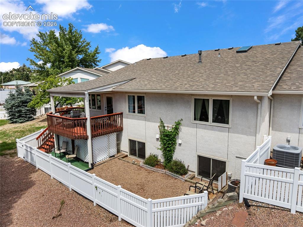 Image 8 of 43: Enjoy not only the covered deck but also a fenced yard!