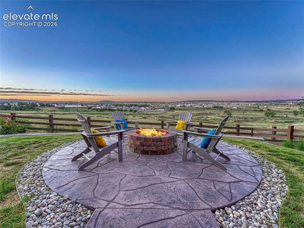 Image 24 of 45: Captivating fireplace, media screen included.