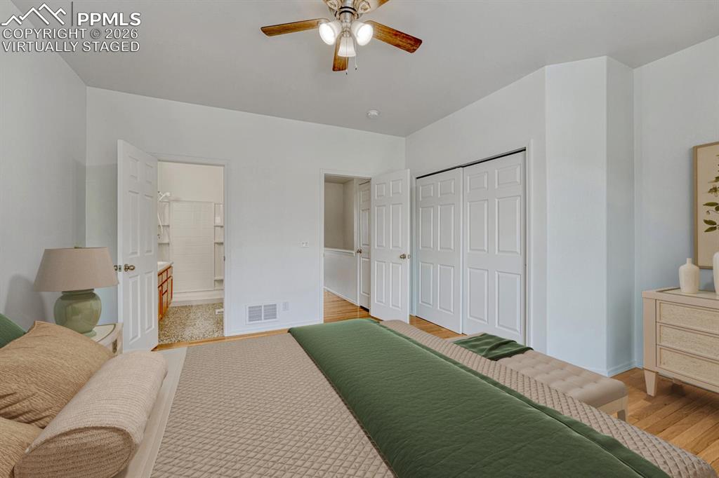 Image 18 of 50: Primary bedroom virtually staged