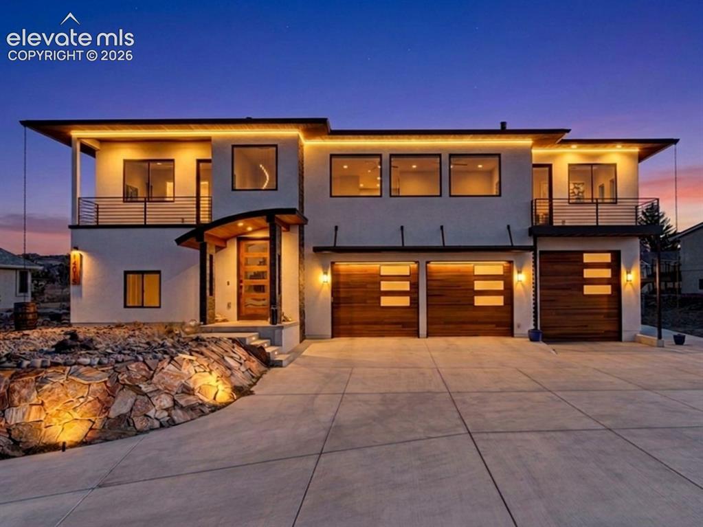 Image 1 of 49: Contemporary exterior with a flat roofline, multiple balconies featuring me
