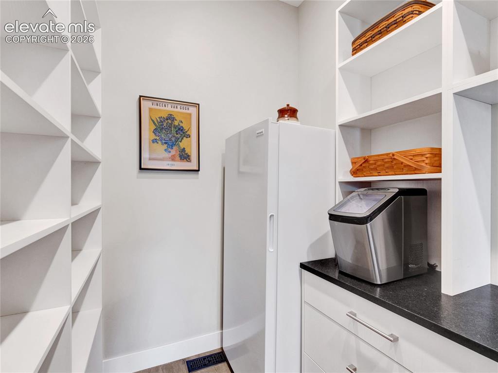 Image 17 of 49: Spacious pantry with freezer
