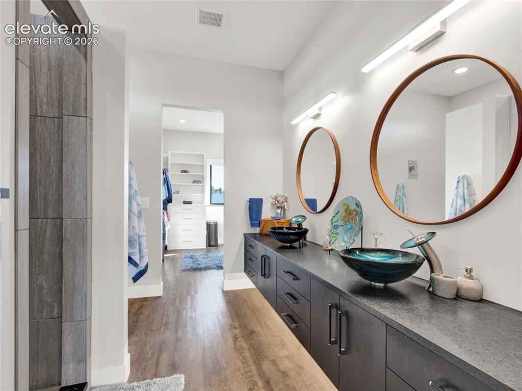 Image 26 of 49: Double vanity with vessel sinks