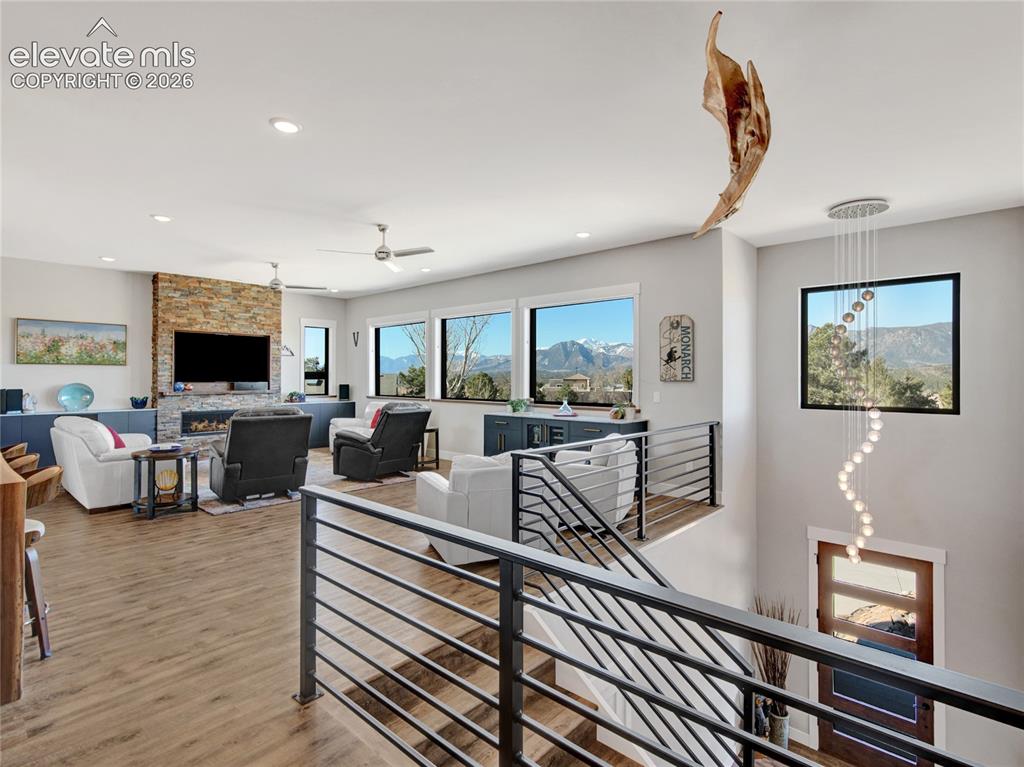 Image 4 of 49: Main living with views of the mountain range