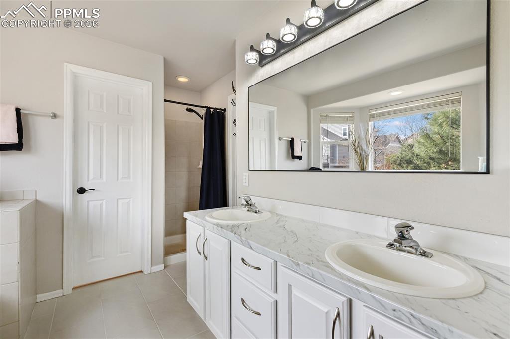 Image 20 of 38: 5 piece primary bathroom with large walk in closet