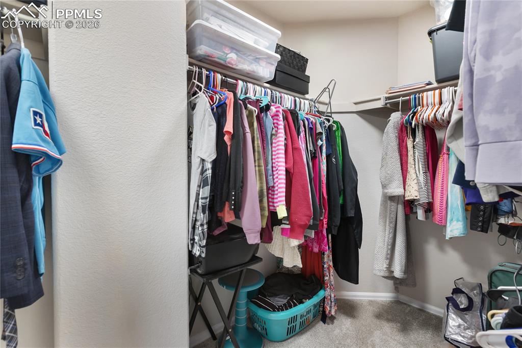 Image 22 of 38: Primary walk in closet