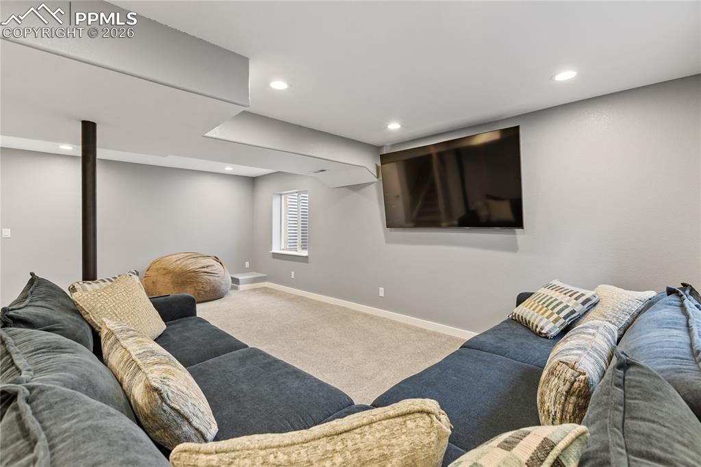 Image 29 of 38: Basement rec room with flat screen TV included
