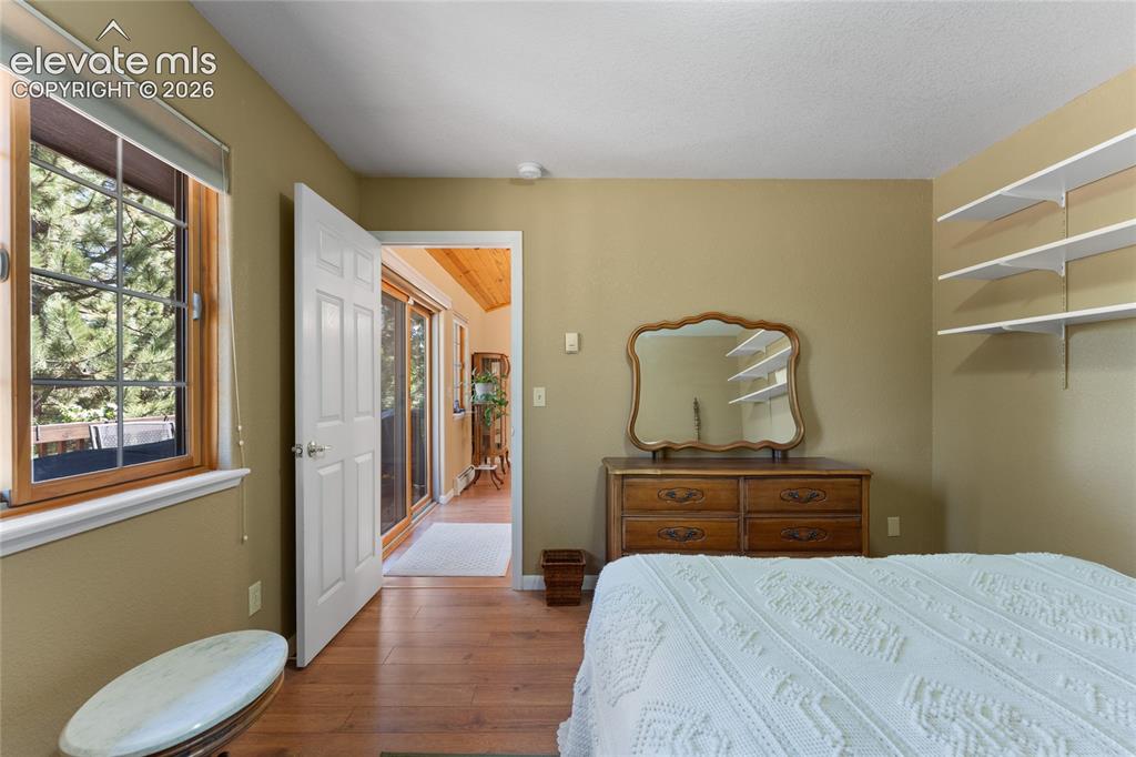 Image 16 of 43: Warm-toned wall paint complements the wood-finish flooring