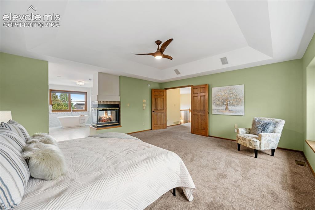 Image 15 of 36: Main level kitchen with granite countertops, stainless steel appliances and