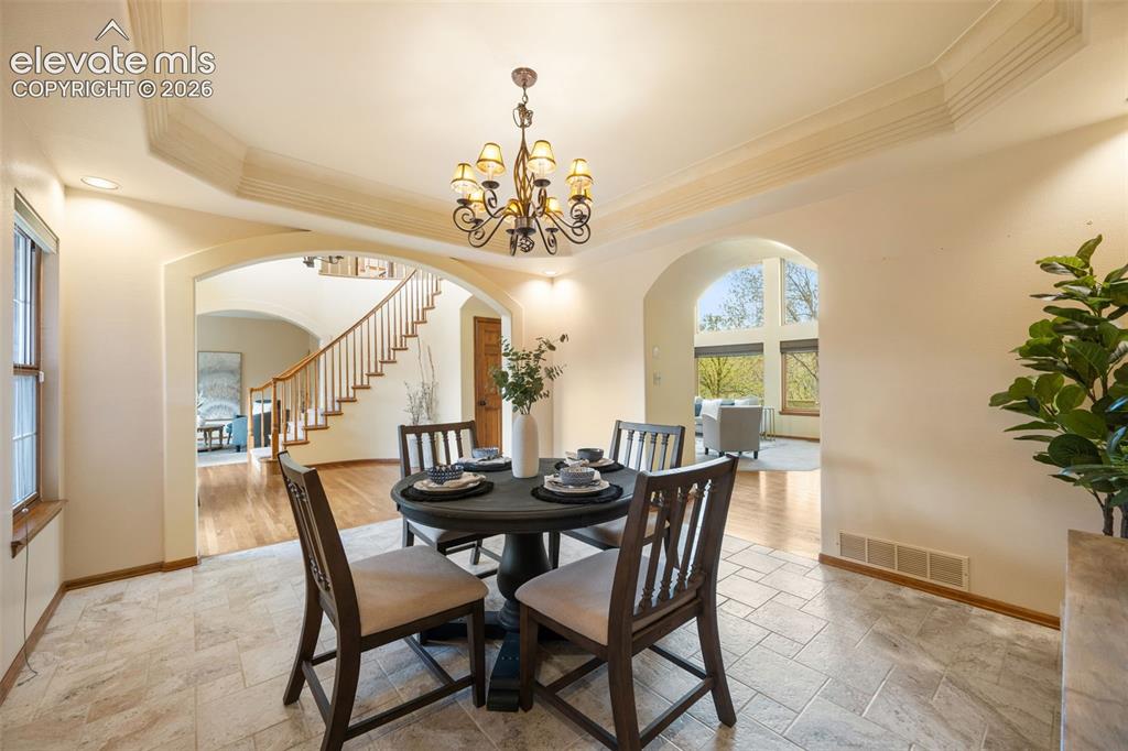 Image 9 of 36: Main level living room with floor to ceiling windows 