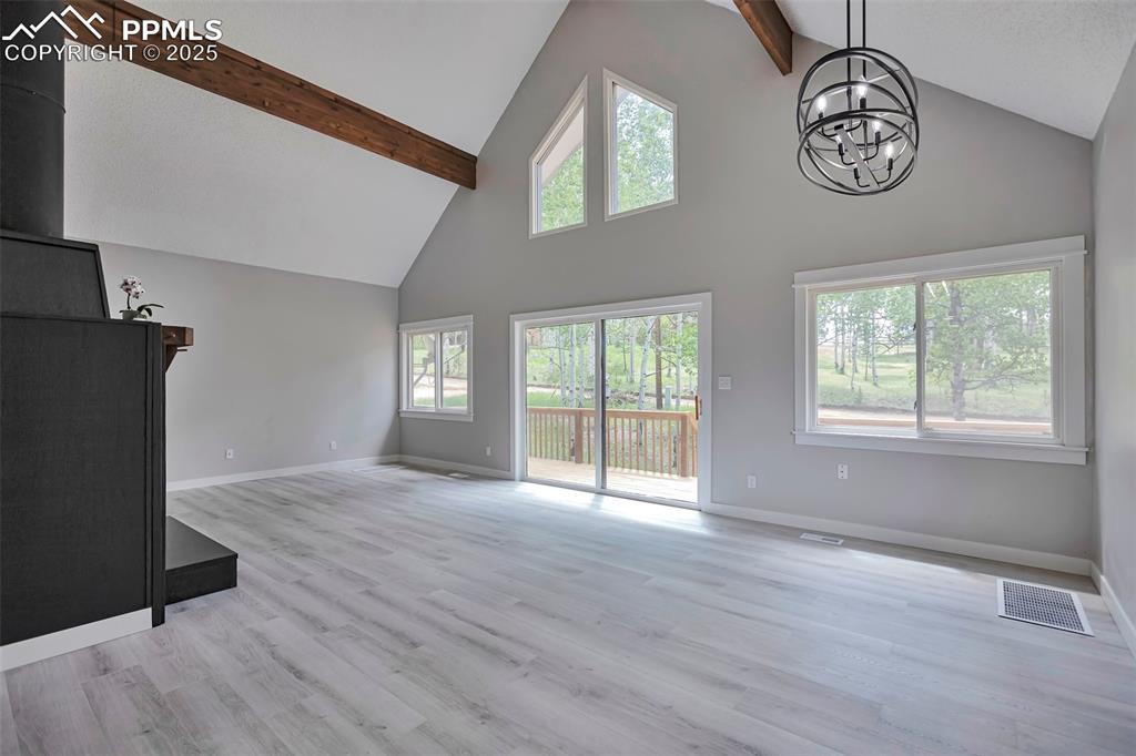 Image 10 of 33: Living room filled with light from windows.