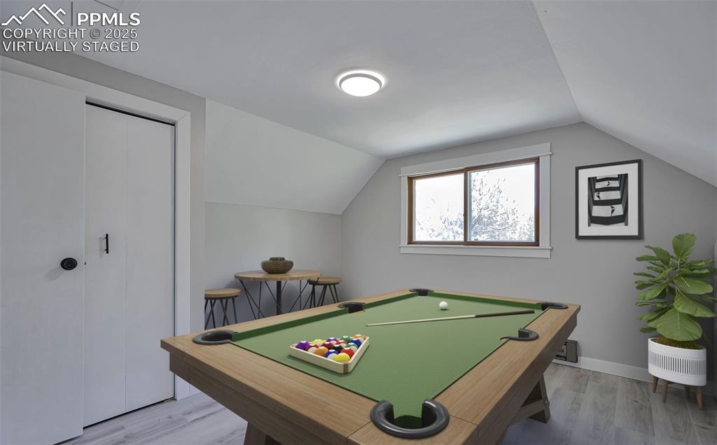 Image 7 of 33: Game room featuring light wood-style floors, billiards table, and lofted ce