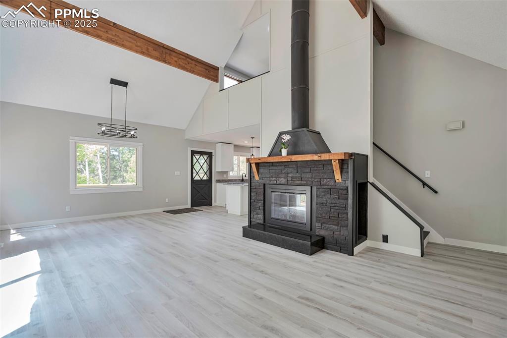 Image 9 of 33: Living Room featuring a fireplace.