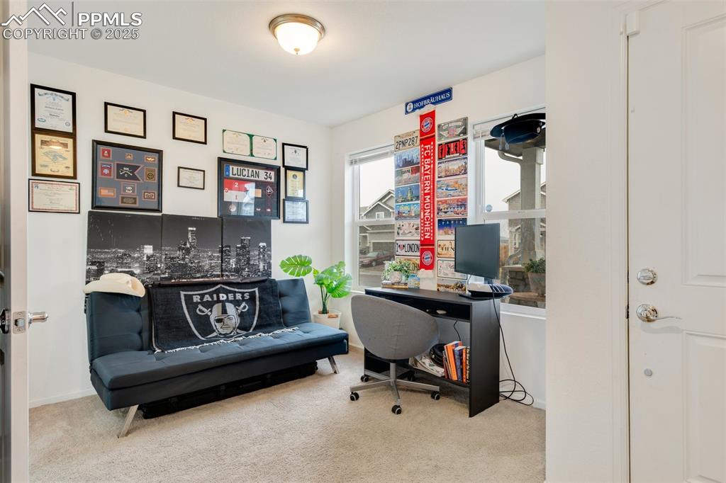 Image 22 of 29: Carpeted office space with baseboards