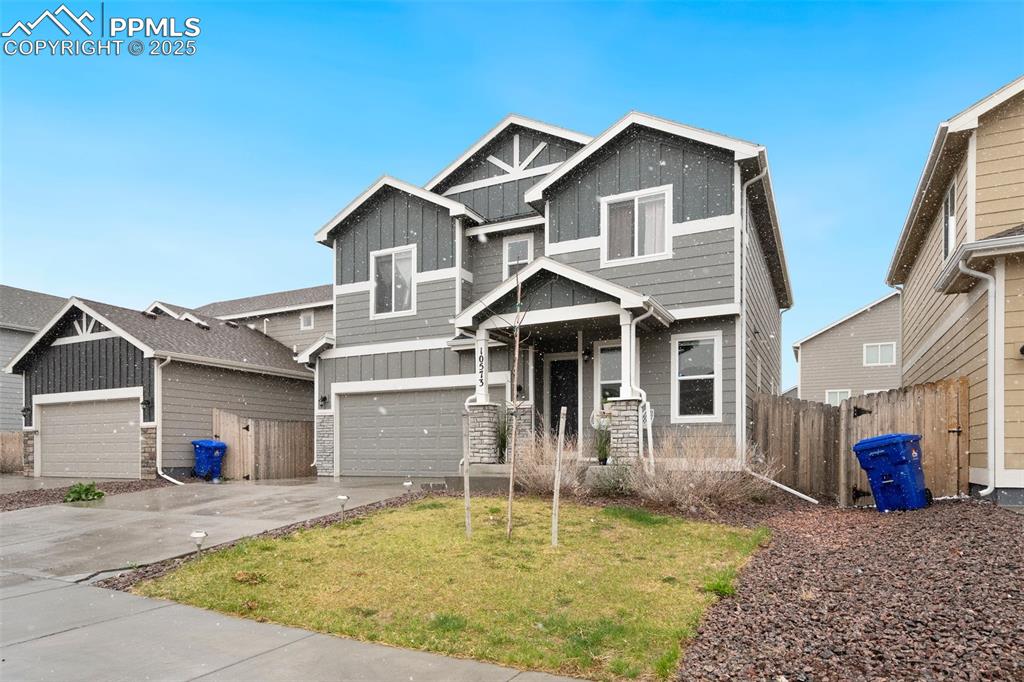 Image 29 of 29: Craftsman house with a front lawn, concrete driveway, fence, an attached ga