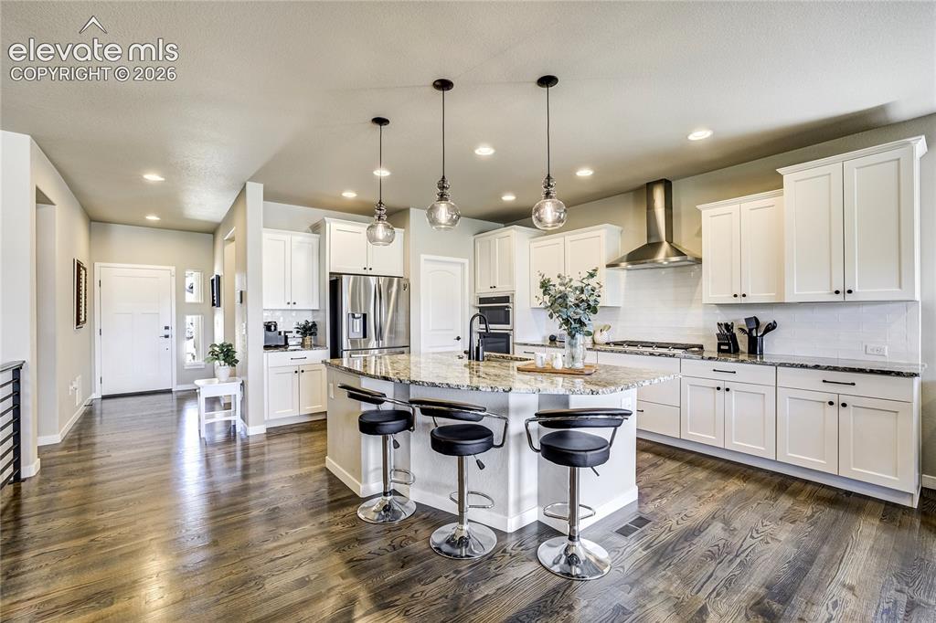 Image 10 of 50: The Heart of the Home |
An oversized island, designer finishes, and mounta