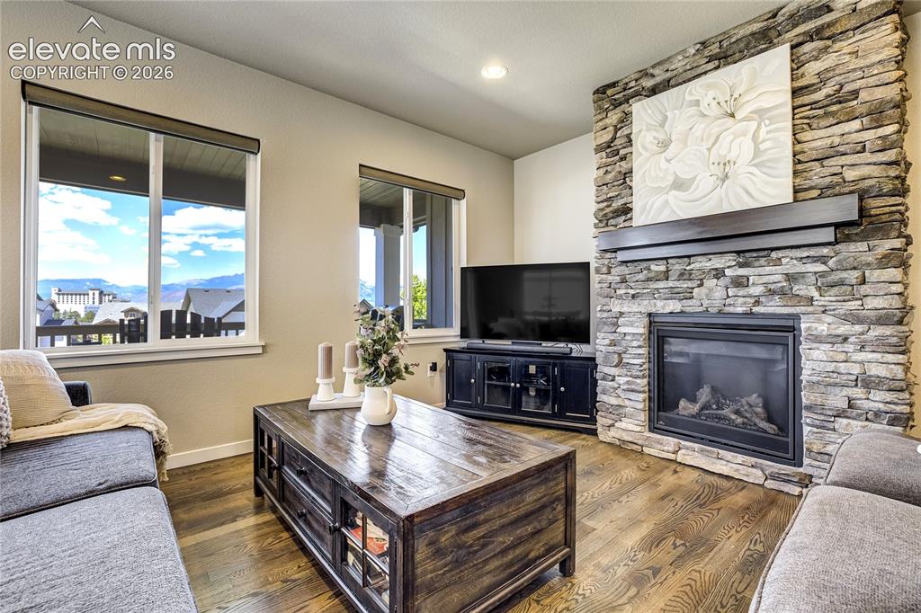 Image 7 of 50: Gather Naturally |
A stone fireplace, expansive windows, and open-concept