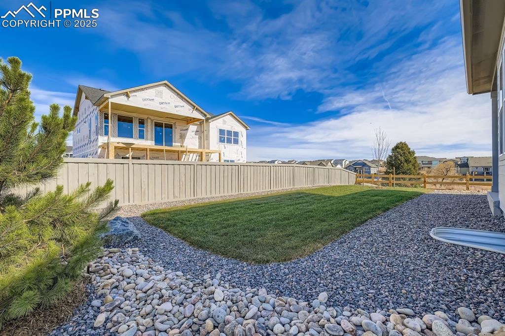 Image 26 of 27: View of fenced backyard