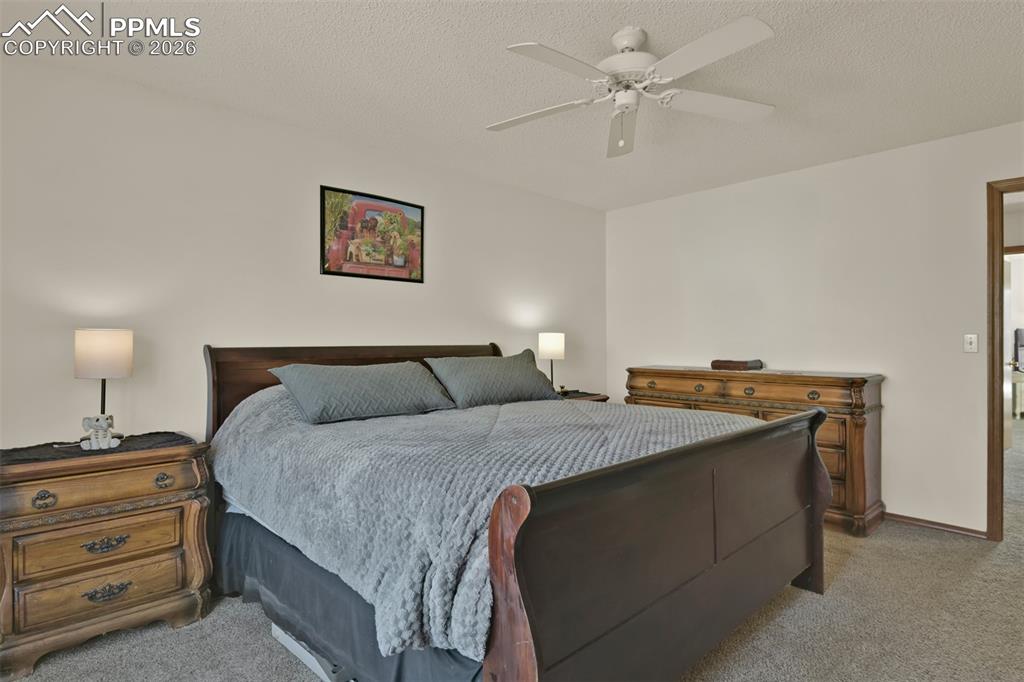 Image 17 of 38: Primary Bedroom Suite with private full bathroom.